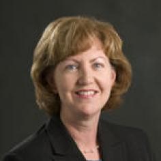 Professional headshot of Suzanne Kroll