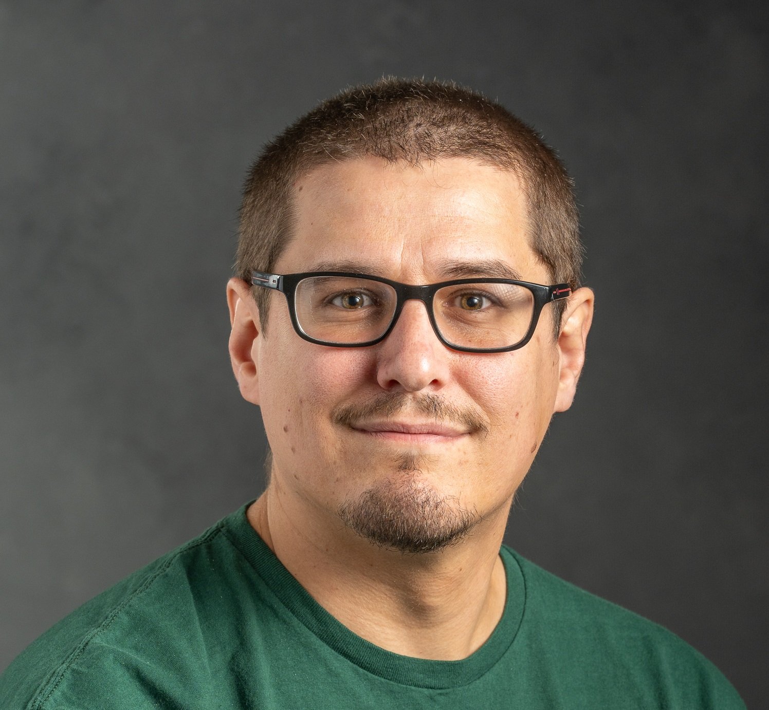 Professional headshot of Christian Parkinson