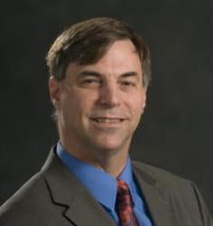 Professional headshot of Charles Owen