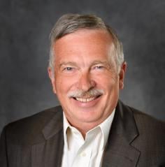 Professional headshot of  Dennis Phillips