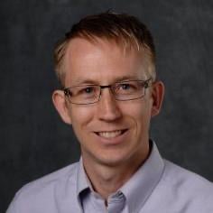 Professional headshot of Geoffrey Recktenwald