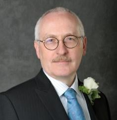 Professional headshot of William Resh
