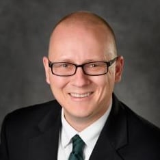 Professional headshot of Peter Savolainen