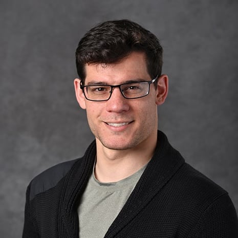 Professional headshot of Justin Scott