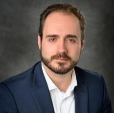 Professional headshot of Aitor Aguirre