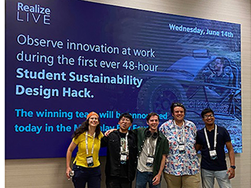Photo of students in front of a screen