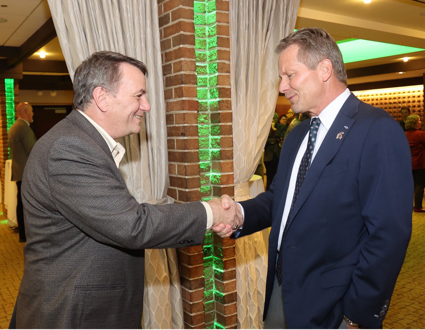 Kempel greets MSU President Kevin Guskiewicz