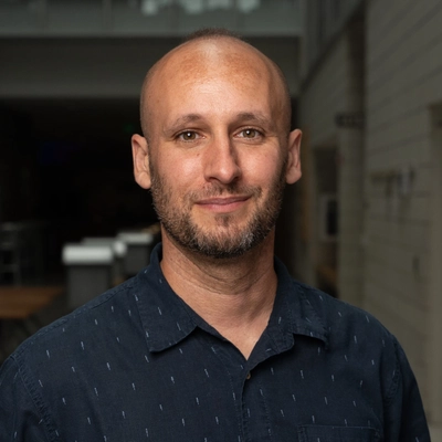 Professional headshot of Tyler Cocker