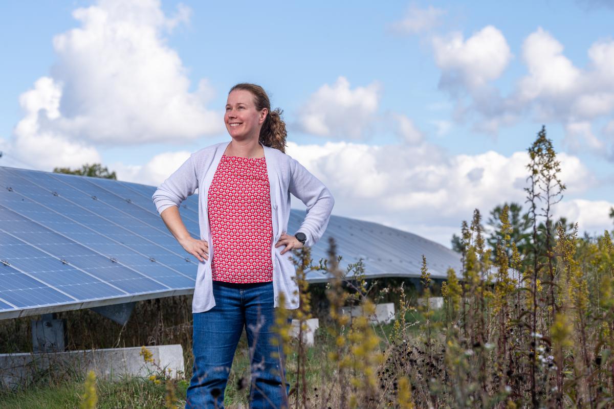 Annick Anctil posing in front of the solar array