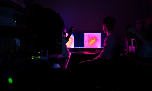 Computer screen with a pink fluorescence