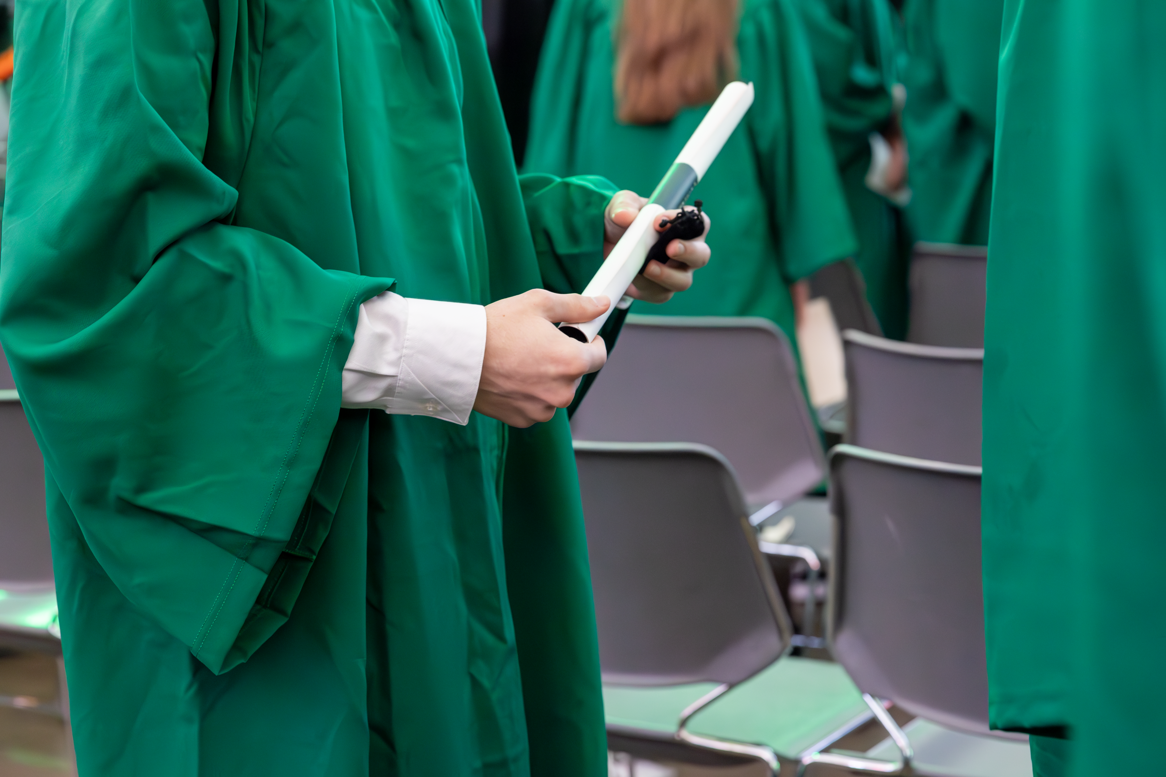 Student holding diploma