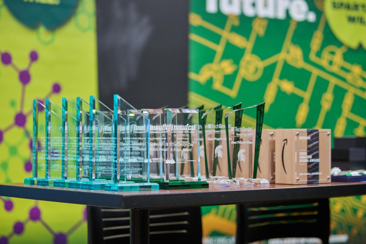 Design Day awards displayed on a table