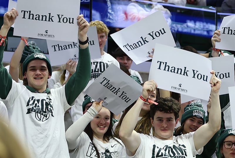 Students holding Thank You signs