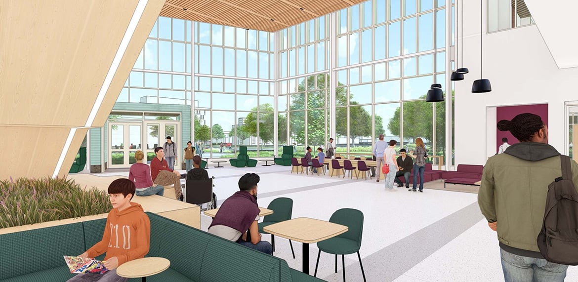 Modern lobby with large windows, seating areas, and people interacting.