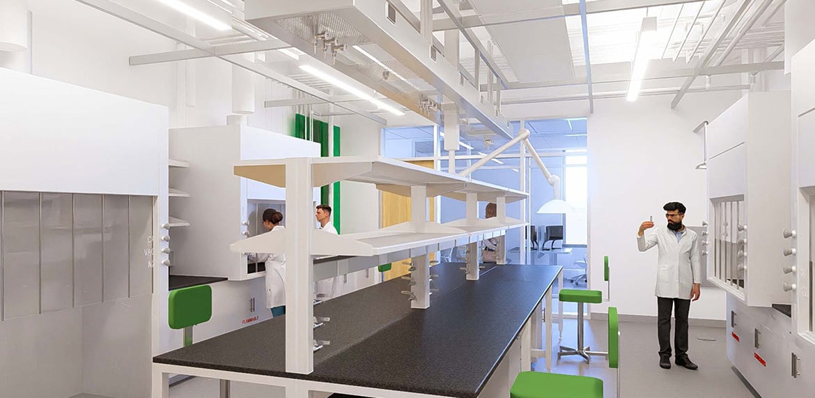 Laboratory with scientists in white coats working at lab benches.