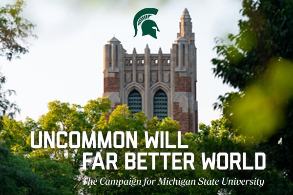 Beaumont Tower rises above trees with text reading “Uncommon Will. Far Better World. The Campaign for Michigan State University.”