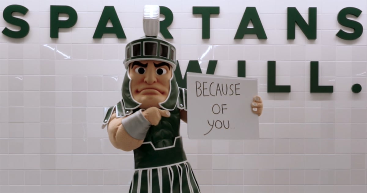 Sparty holding a sign that says Because of You