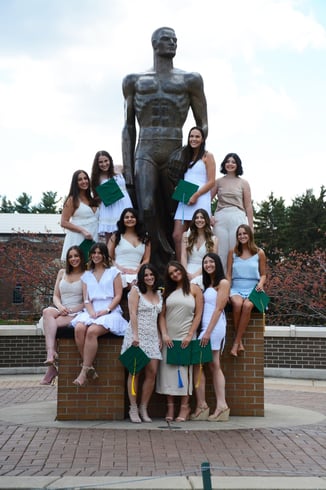Hackman and friends pose with Sparty statue.
