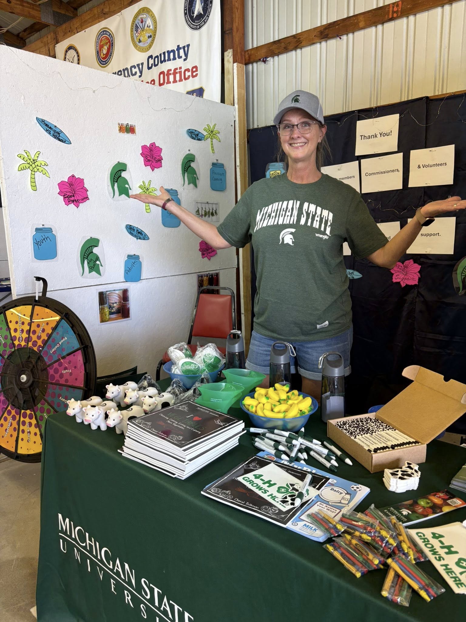 Woman at a 4-H booth.