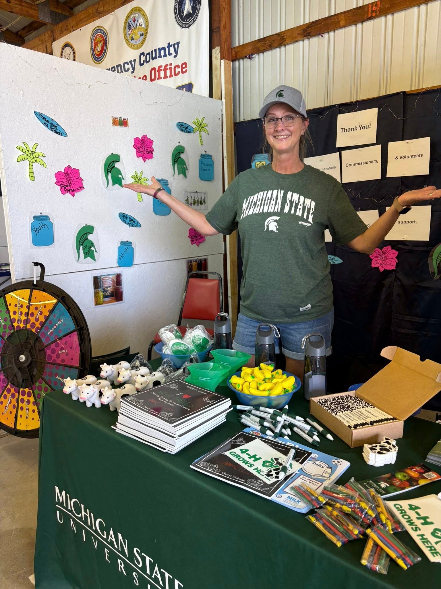Woman at a 4-H booth.