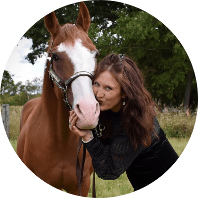 Woman hugging horse.