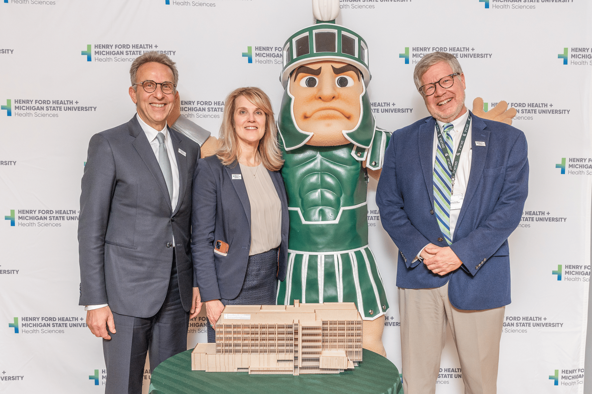 Leadership poses with Sparty.