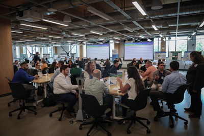 Event participants sitting at tables having discussions
