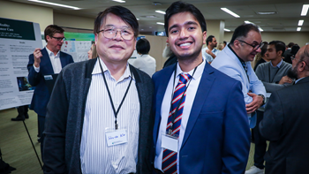 two poster winners smiling