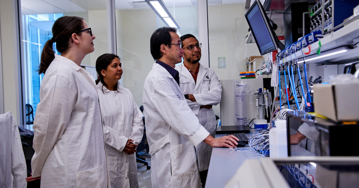 Xiaopeng Li with colleagues in the cell lab