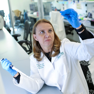 Jenny Klomp looking at tests in lab.