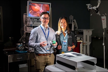 MSU student with a Henry Ford surgeon posing with equipment