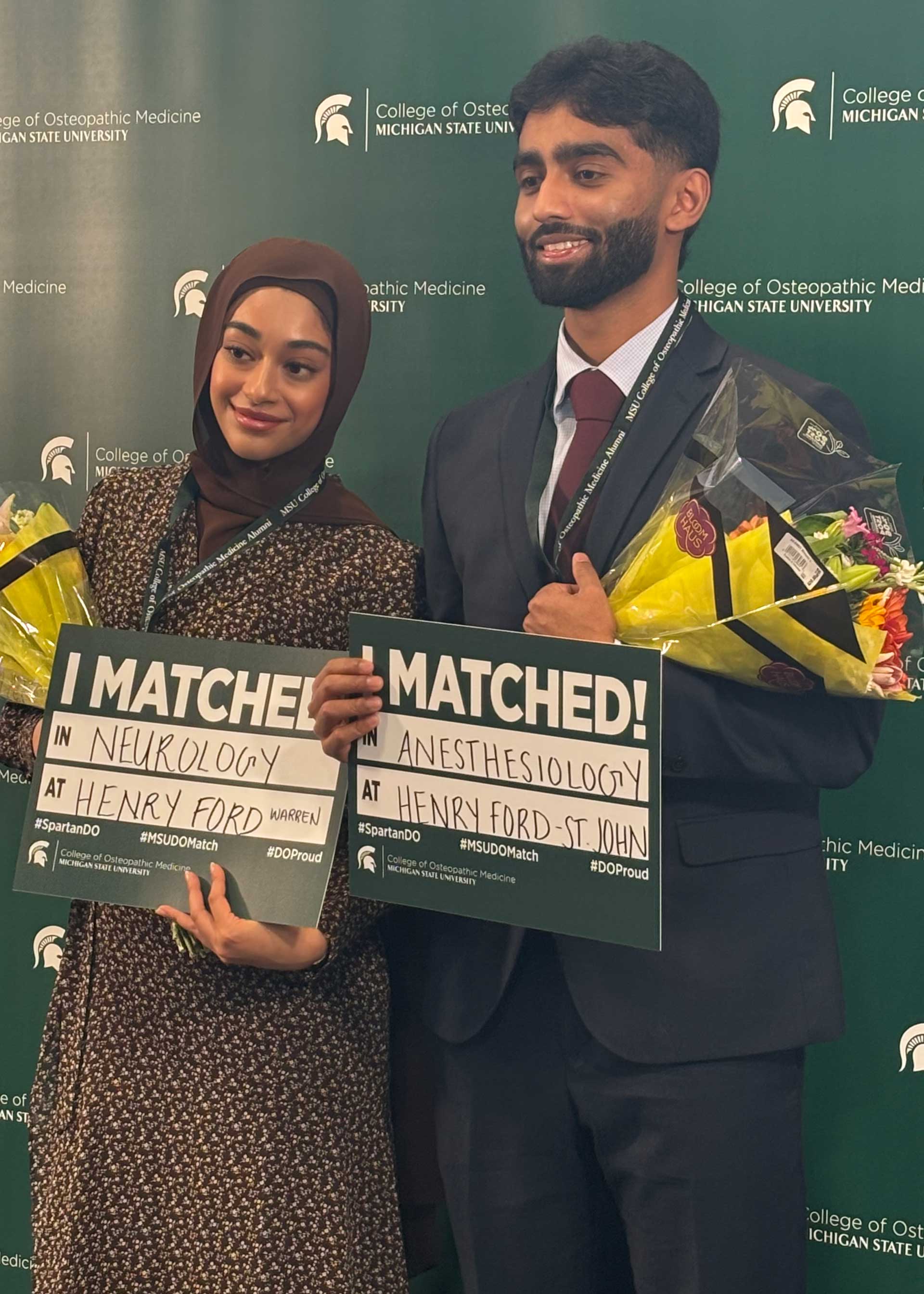 MSU COM student holding the "I Matched!" sign