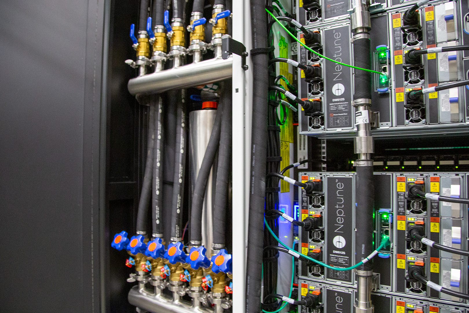 Water pipes next to computer hardware. 