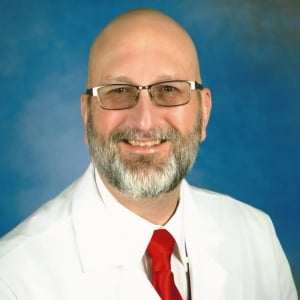 A headshot photo of Doctor Thomas Claringbold