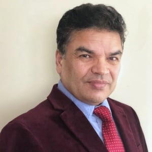 A headshot photo of doctor Ramjee Ghimire