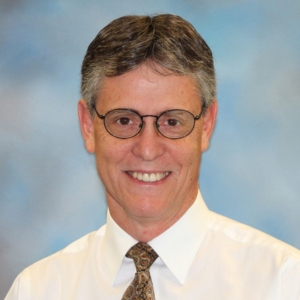 A headshot photo of Mark Hodgins