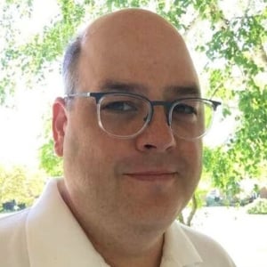 A headshot photo of doctor Jay Loftus