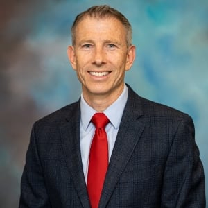 A headshot photo of Doctor Jacob Rowan