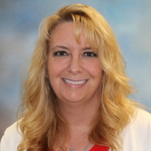 A headshot photo of Stephanie Six