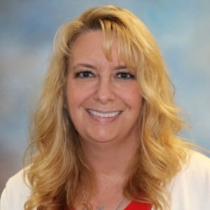 A headshot photo of Stephanie Six