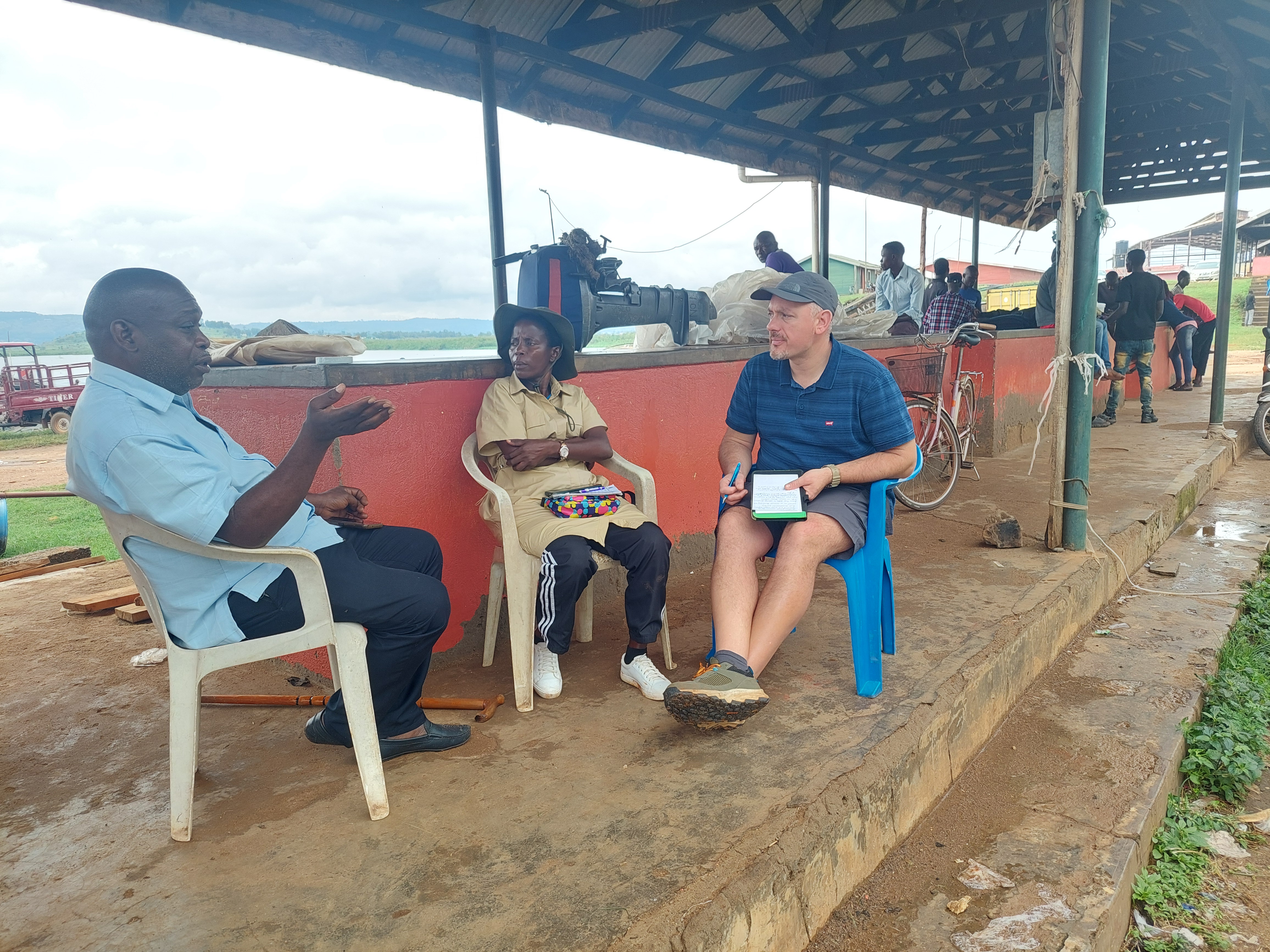 Dr. Gorgoglione (right) and Dr. Nalwanga (center) talking with the founder of the Masese Cage Fish Farmers Cooperative in Jinja, Uganda.