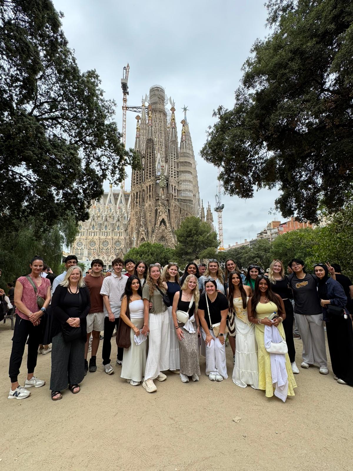 Ava Richardson standing with her MSU student education abroad cohort in front of the Sagrada Familia chapel in Barcelona.