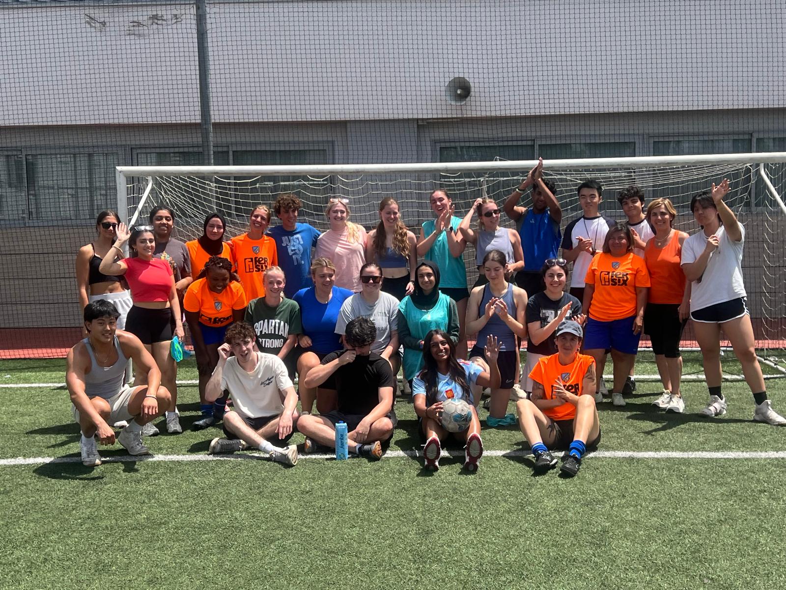 Ava Richardson, along with her cohort of MSU students, posing for a group photo after a soccer match