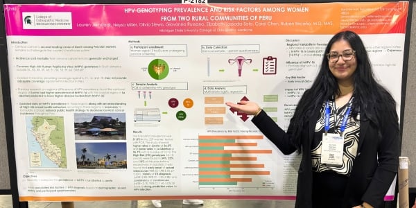 MSU COM student Olivia Slewa presenting a poster at the ID Week Conference in Atlanta, Georgia