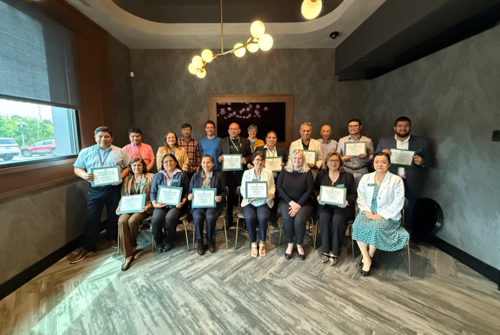 Universidad César Vallejo faculty holding leadership development workshop completion certificates with members of the MSU Global Health Institute