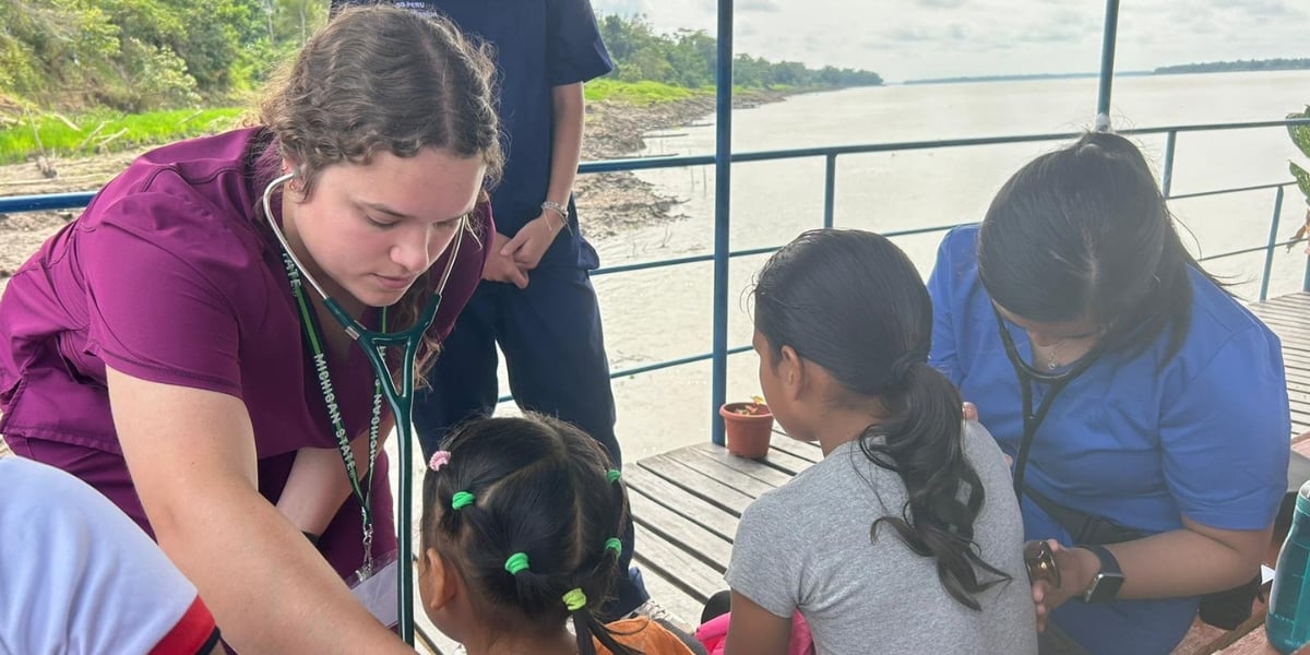A MSU College of Osteopathic Medicine student providing primary care for an Iquitos resident