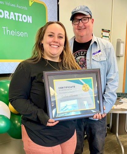 Amber Theisen, holding her award plaque, and Eddie Boucher at the 2026 awards ceremony.