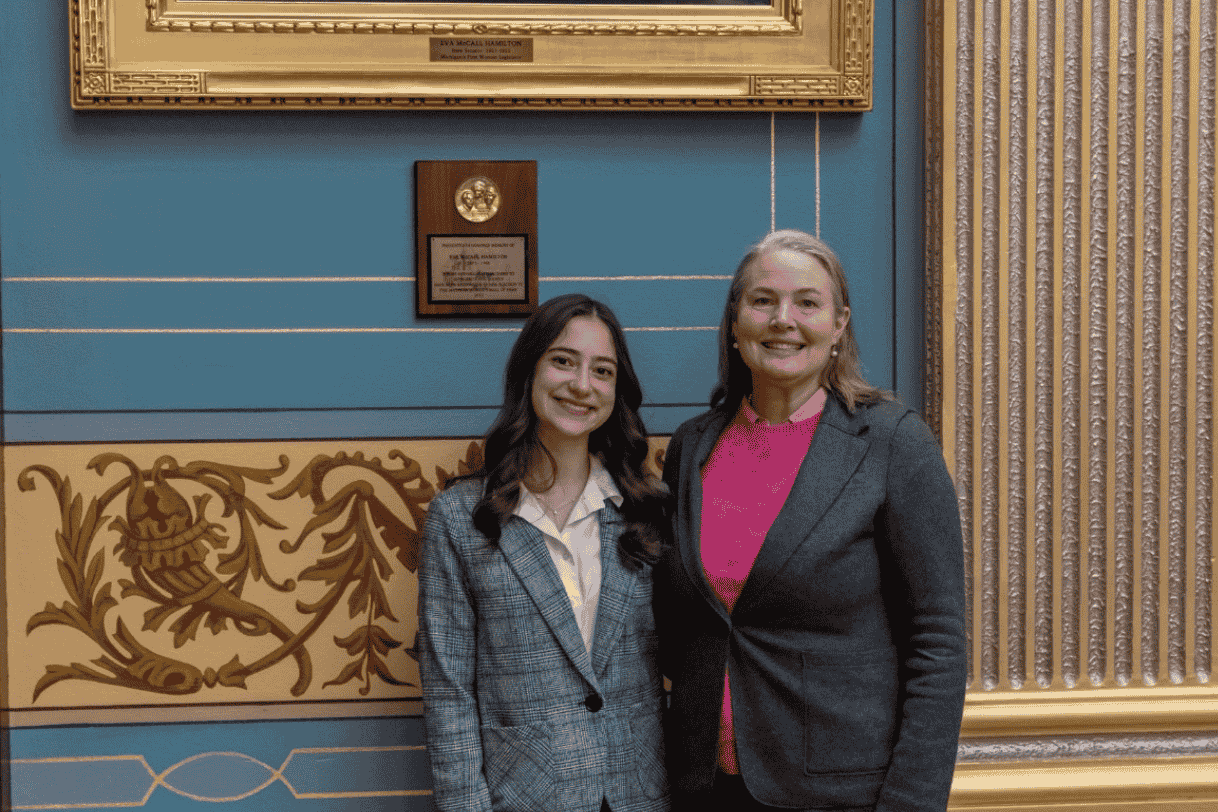 Dide Karaboga next to State Senator Sue Shink