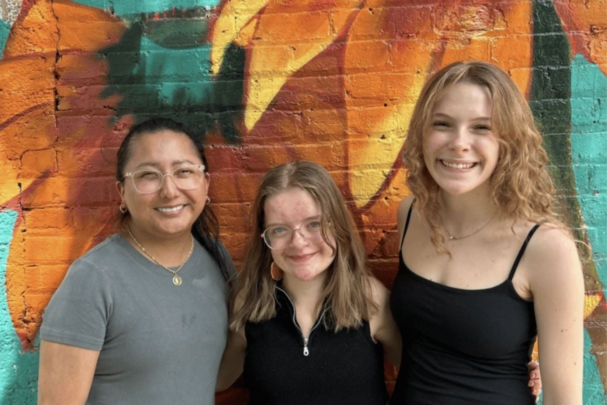 Abigail Dzikowicz pictured next to two coworkers.