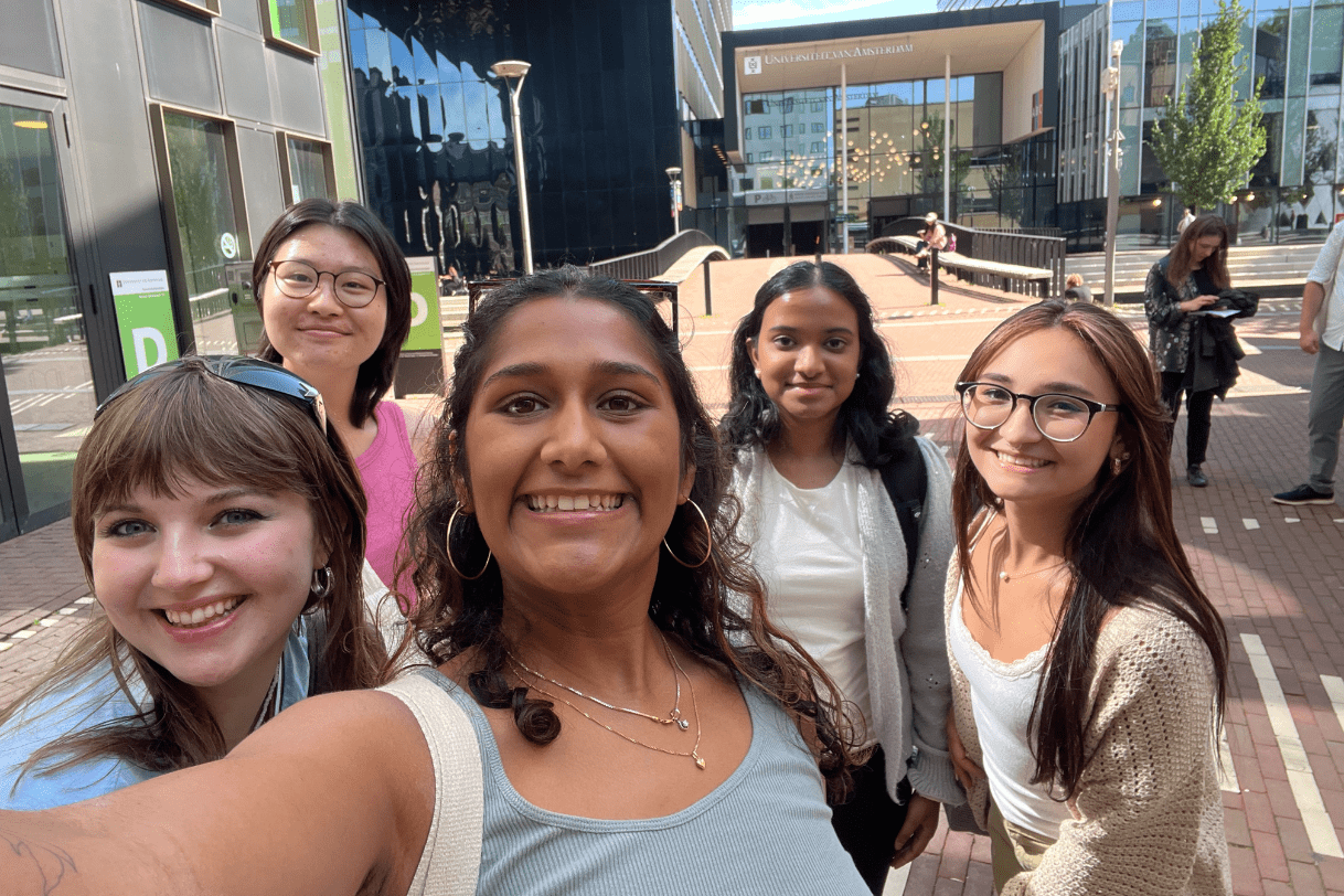A group of Madison students posing together for a selfie during the "Sexual Orientation, Gender Identity, and Sexual Politics" education abroad program at the University of Amsterdam in Summer 2025.